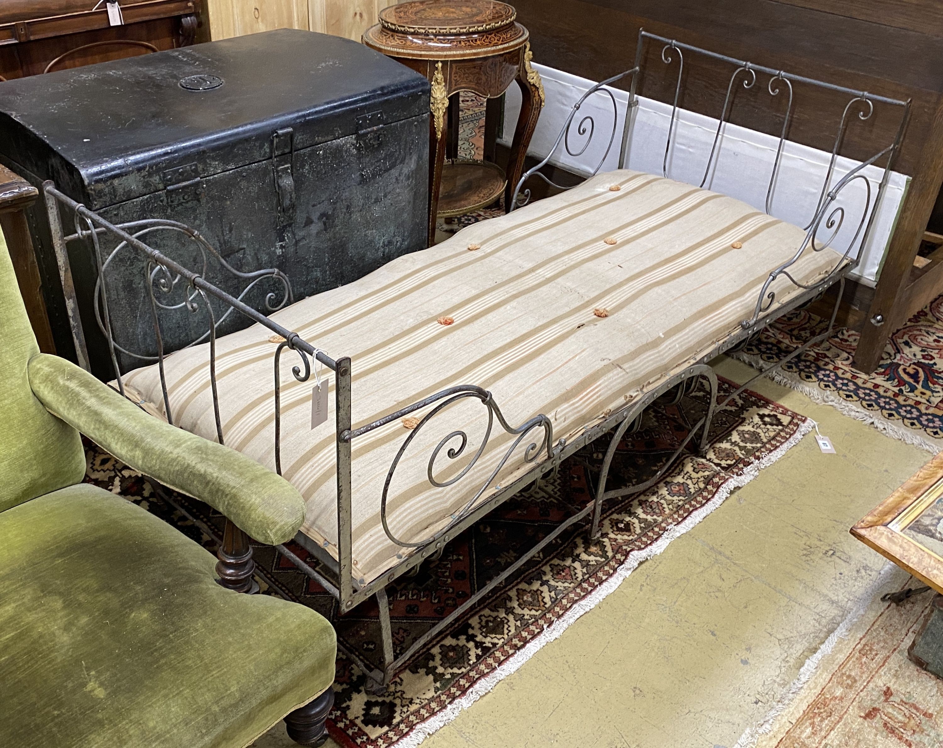 A 19th century Continental wrought iron folding campaign bed, width 79cm, length 181cm